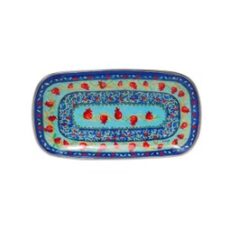 Metalen dienblad met granaatappels